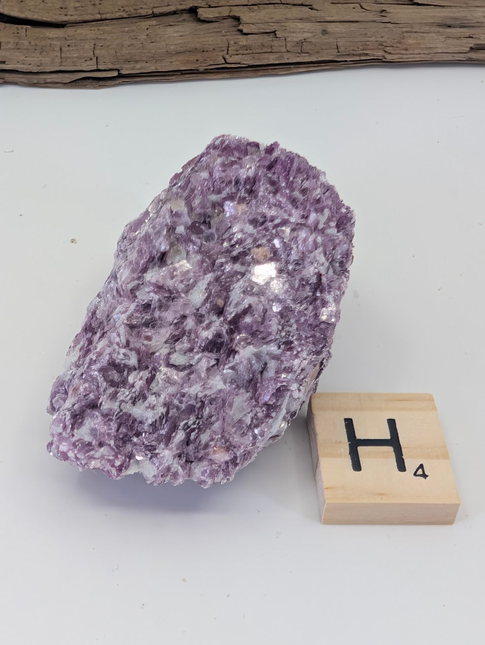 Highly saturated magenta-purple Lepidolite mica showing excellent color density and shimmer.