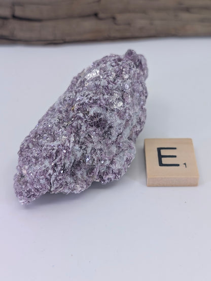 Naturally occurring lavender Lepidolite mica specimen with a thin, shimmering profile.