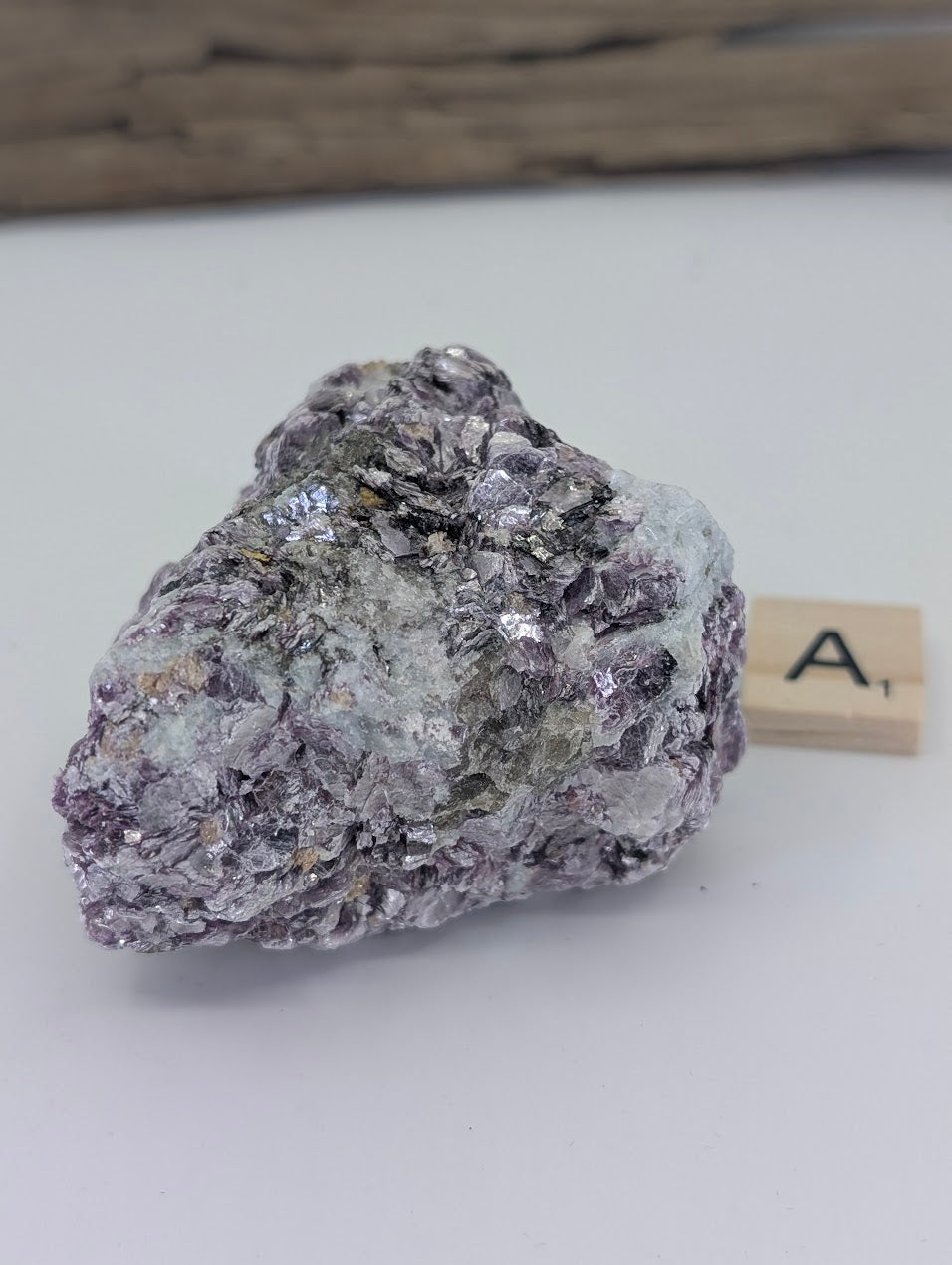 Raw purple Lepidolite specimen with white quartz matrix and shimmering mica flakes.