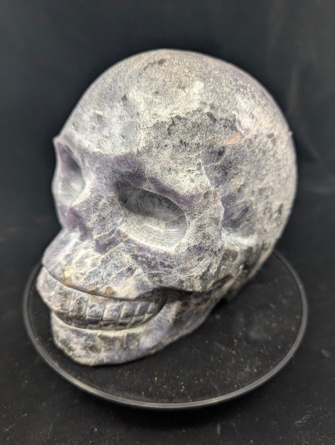 Angled view of Lepidolite Skull showing mica shimmer