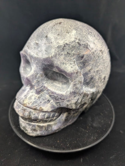 Angled view of Lepidolite Skull showing mica shimmer