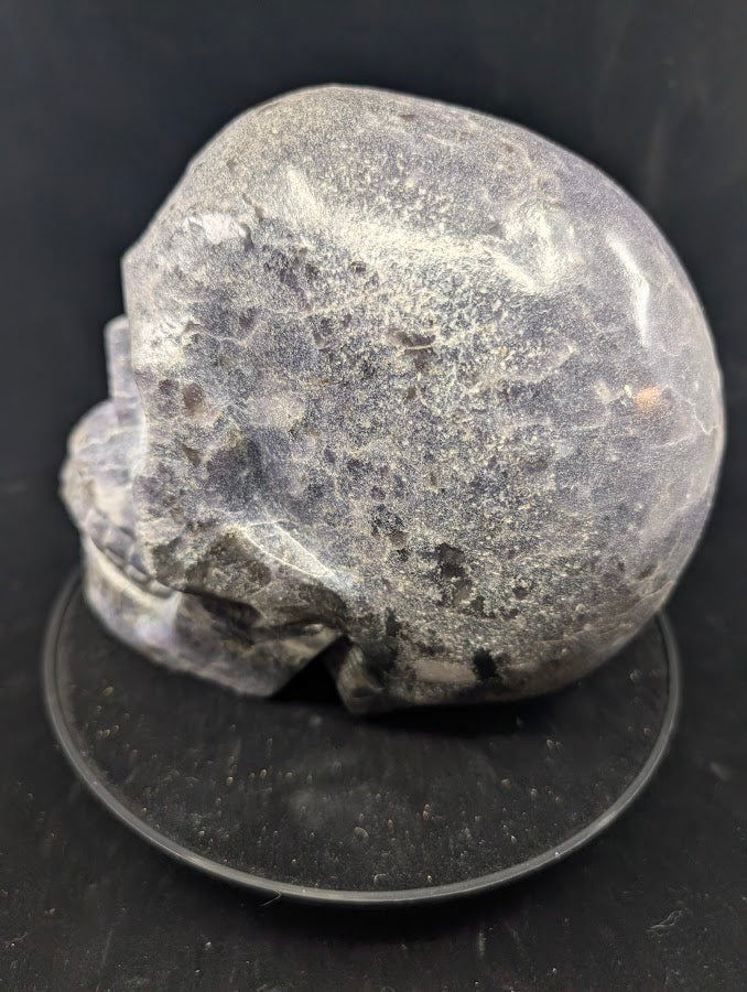Side profile of Lepidolite Skull with lavender-grey tones