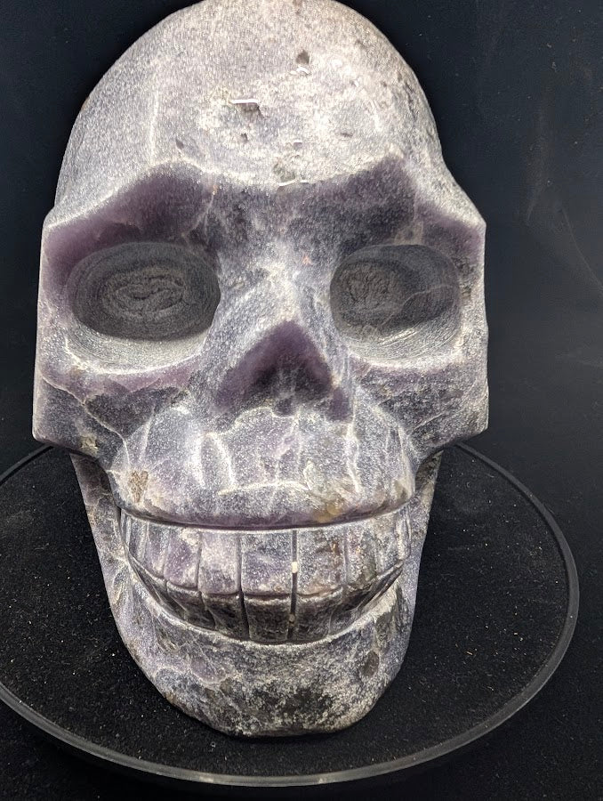 Detail close-up of Lepidolite Skull showing reflective mica