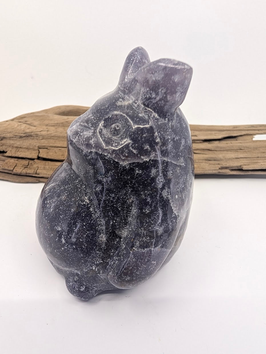 Side profile of a 245g Lepidolite Totoro carving showcasing its rounded silhouette.