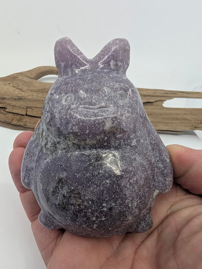 445g Lepidolite Totoro held in hand for scale against a white background.