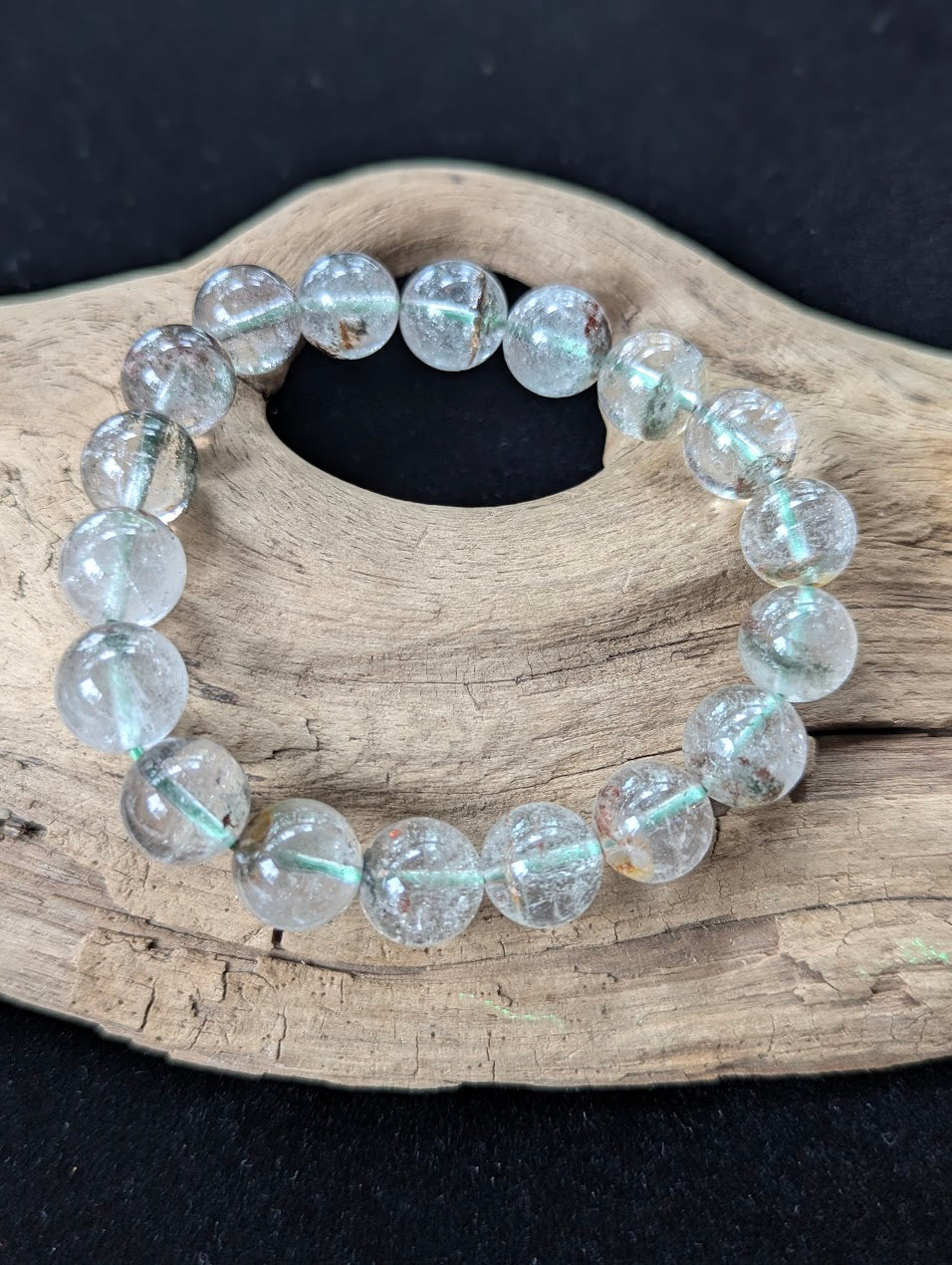 11mm Light Garden Quartz (Lodolite) Bracelet, showcasing large clear beads with distinct mineral landscapes.