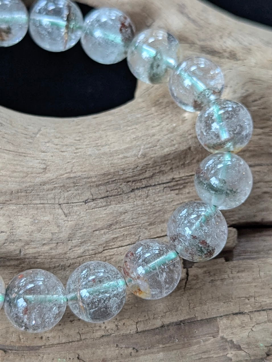 Close-up of 11mm Light Garden Quartz (Lodolite) Bracelet, detailing organic inclusions within the quartz matrix.