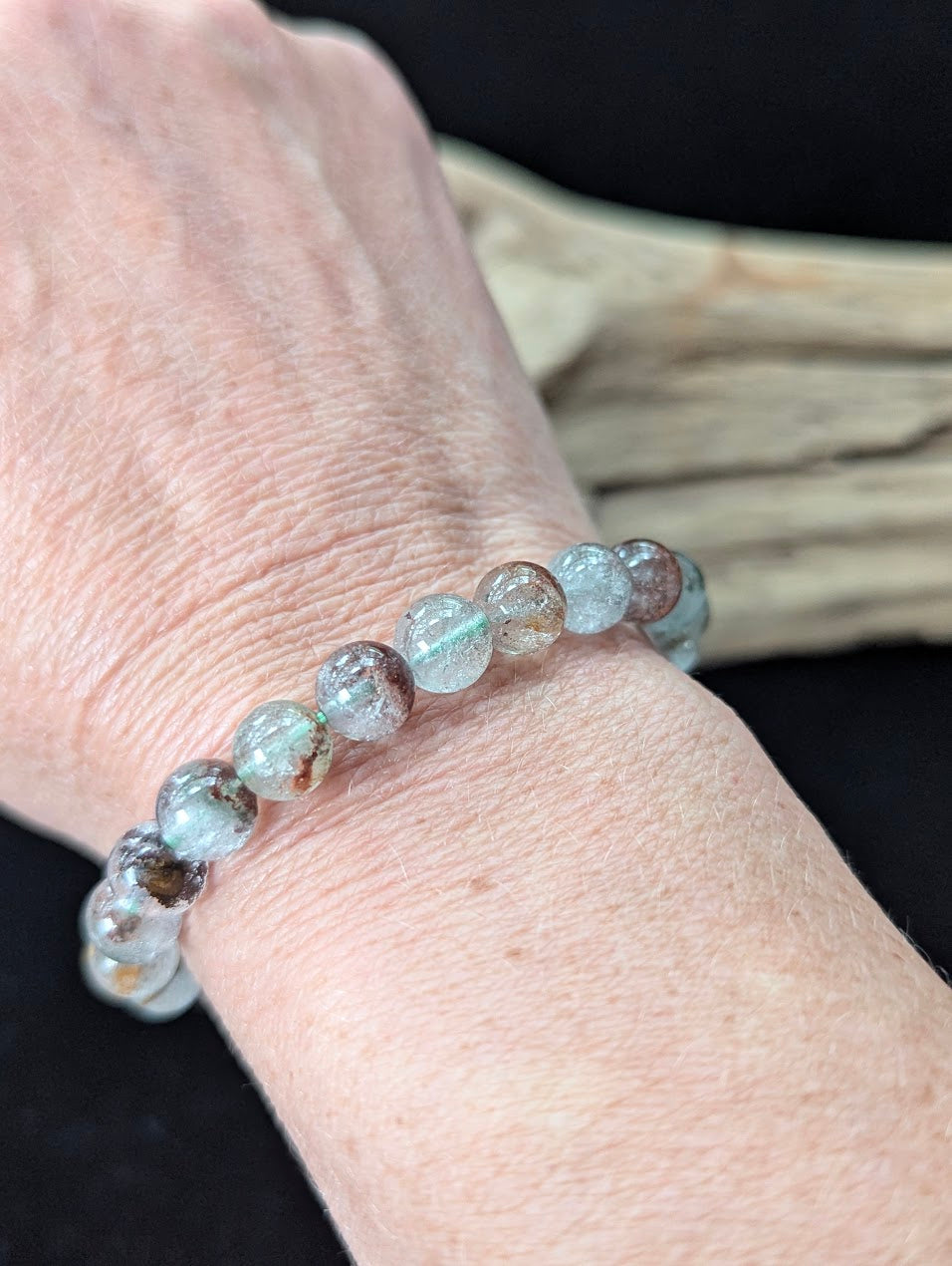 8mm Light Garden Quartz (Lodolite) Bracelet shown worn on a wrist.