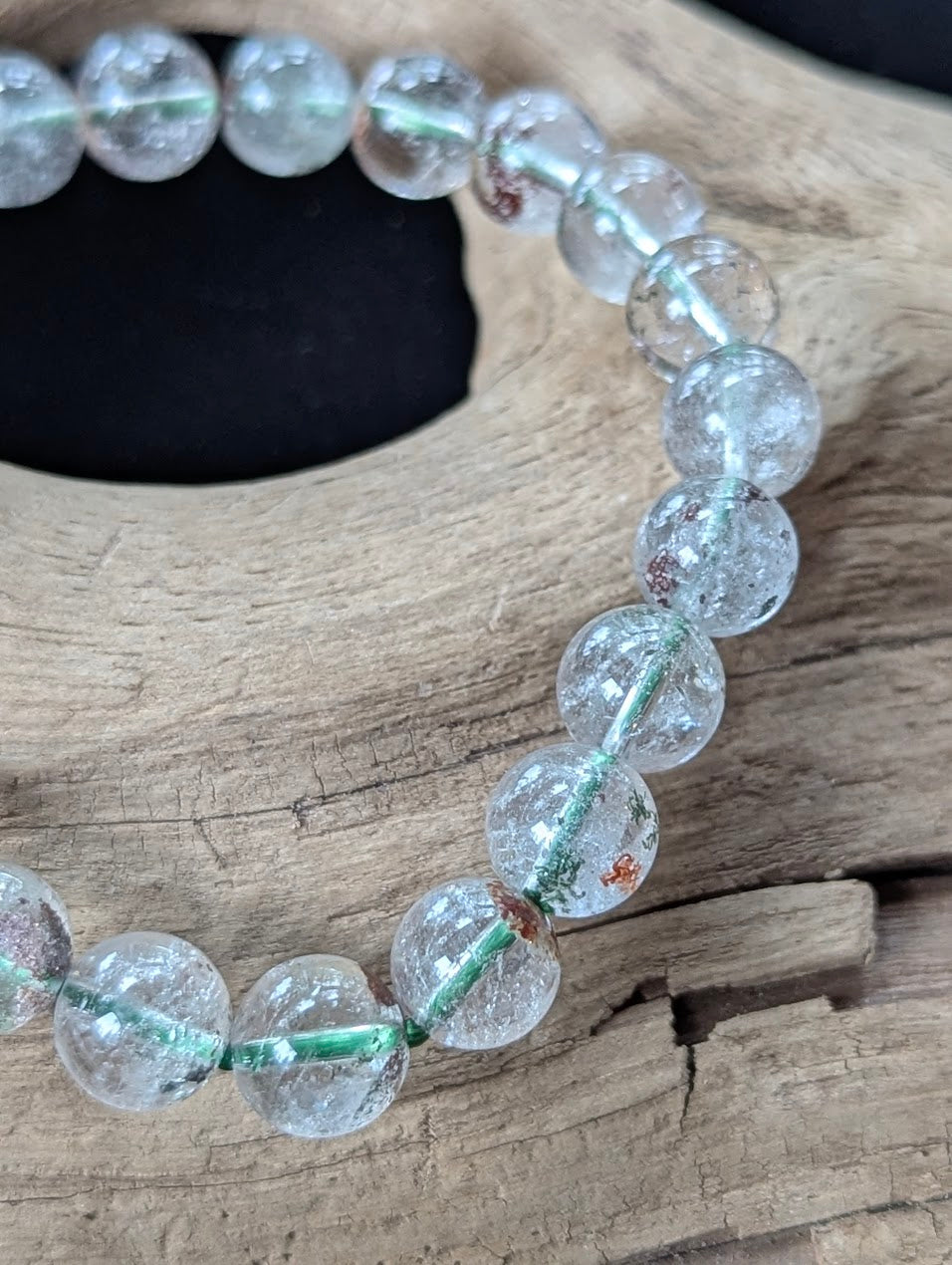 Close-up of 9mm Light Garden Quartz (Lodolite) Bracelet, detailing pristine polish and varied internal patterns.