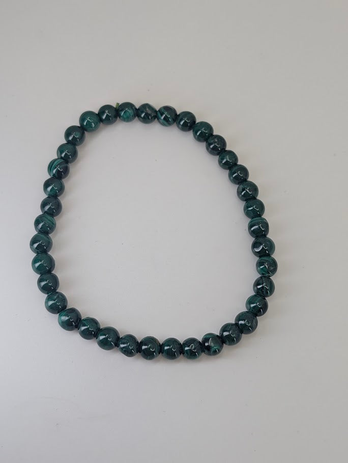 5mm round Malachite beads with natural sheen and smooth polish