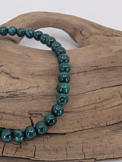 Close-up of Malachite bracelet highlighting deep green concentric band patterns