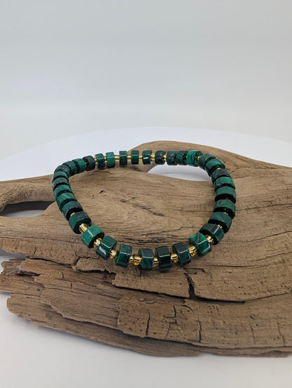 Natural malachite cube bracelet on driftwood showing deep green banding