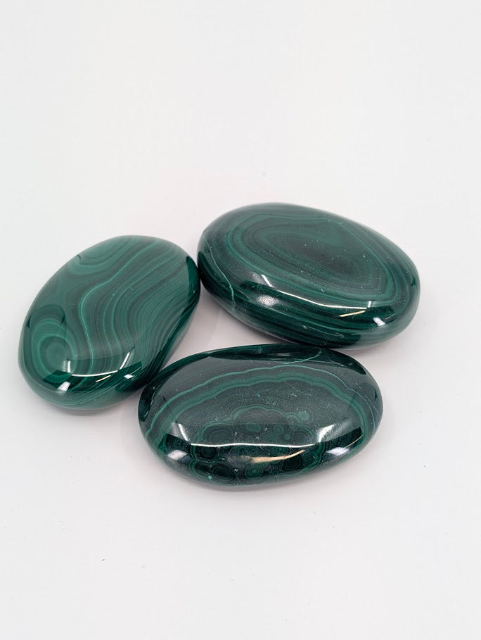 Malachite Palm Stones showing vivid green banding and polish