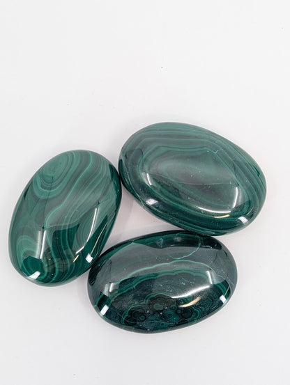 Top view of Malachite Palm Stones showing color variation