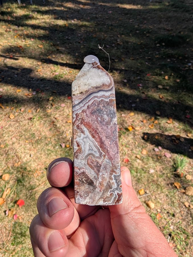 Mexican Lace Agate Tower back view – polished agate with flowing banding patterns