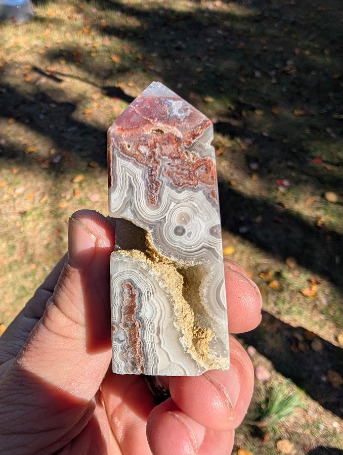 Mexican Lace Agate Tower #3 angled view — compact specimen with multiple quartz-filled vugs