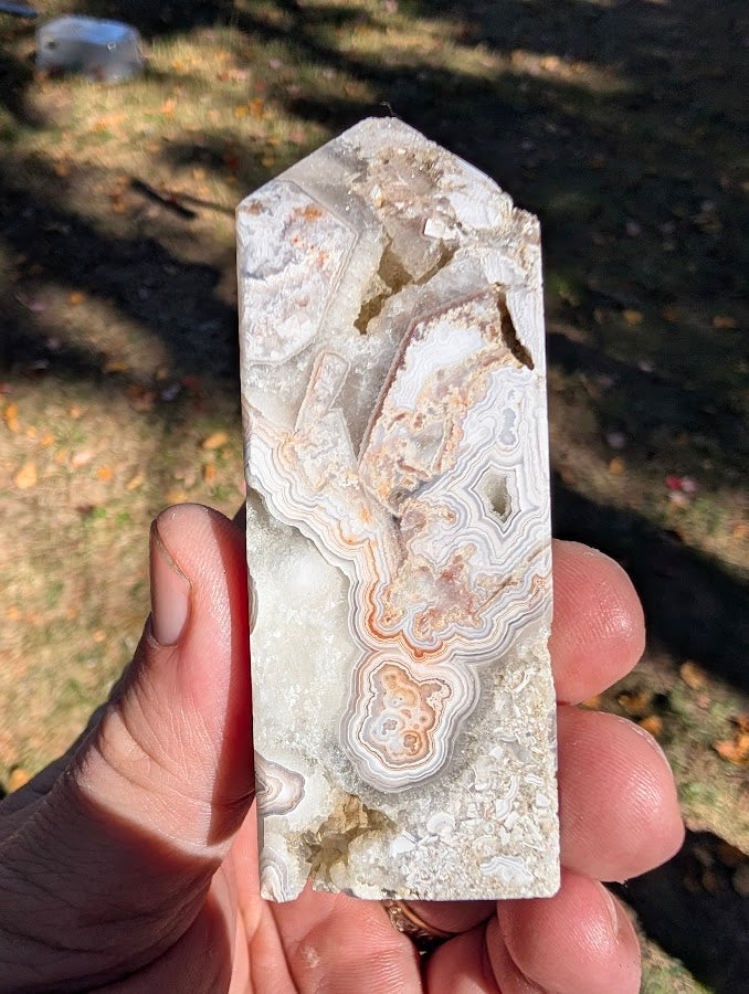 Mexican Lace Agate Tower #4 front view — 85 mm polished tower with pastel lace banding and quartz vugs