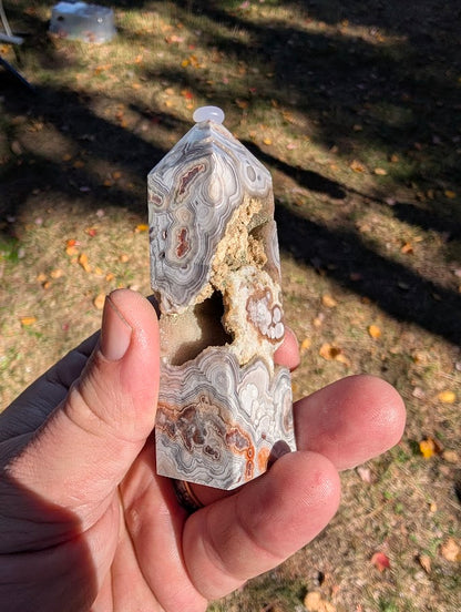 Mexican Lace Agate Tower #7 angled view — compact tower with eye patterns and druzy sparkle