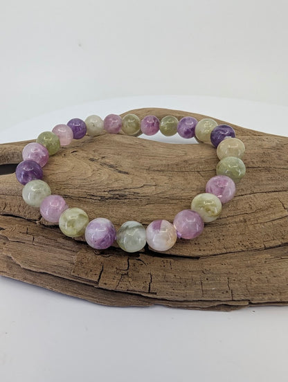 8mm mixed mica bracelet from Brazil featuring purple Lepidolite and green Muscovite beads on driftwood.