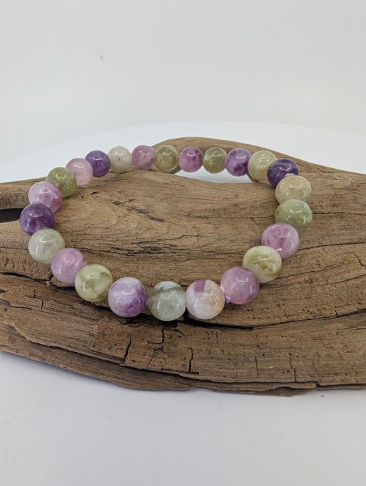 8mm mixed mica bracelet from Brazil featuring purple Lepidolite and green Muscovite beads on driftwood.