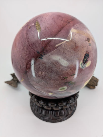 Deep plum colored Mookaite stone sphere with a smooth, glass-like polish on the silicified chert.
