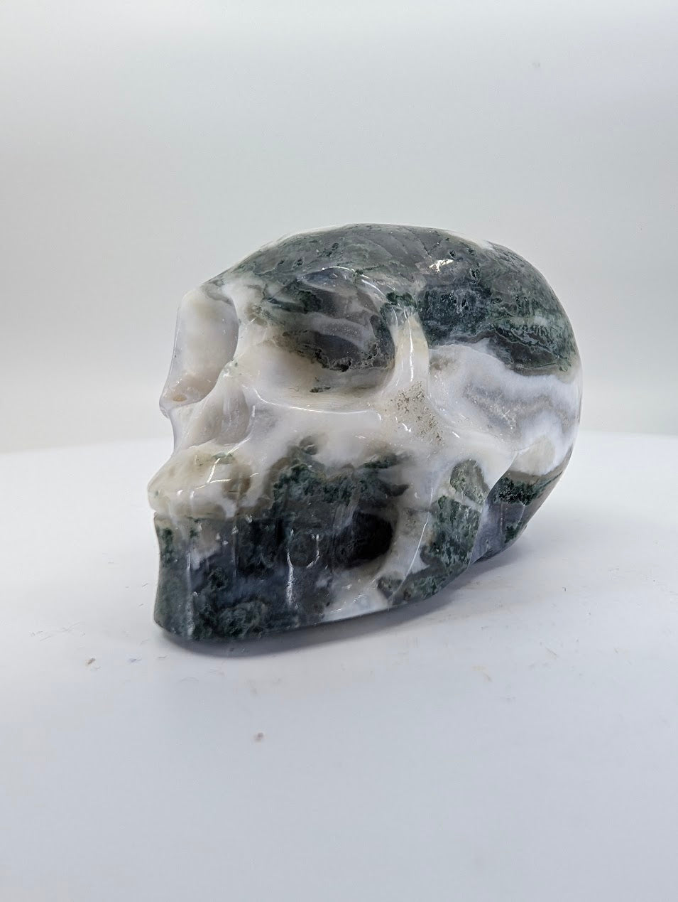 Moss Agate crystal skull carving – 41mm hand-carved natural stone – Legacy Crystals and Minerals