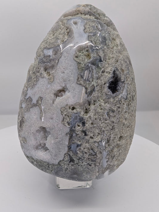 Polished moss agate egg approximately 5 inches tall and 1 kg showing earthy moss inclusions