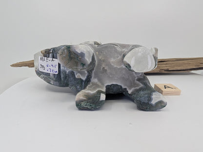 Hand-held view of Moss Agate elephant A showing scale and light transmission through the translucent chalcedony.