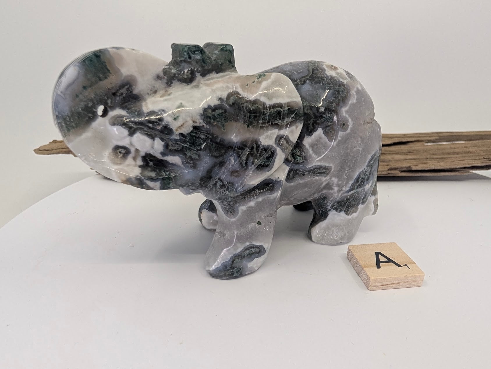 Reverse side of Moss Agate elephant A showing intricate dendritic mineral patterns.