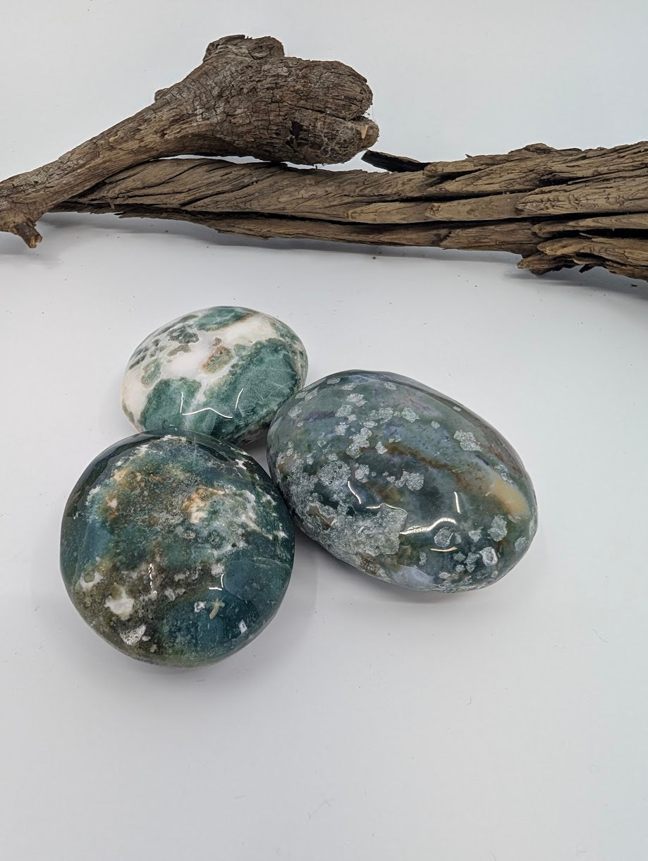 Moss Agate palm stone with deep green inclusions and translucent chalcedony base