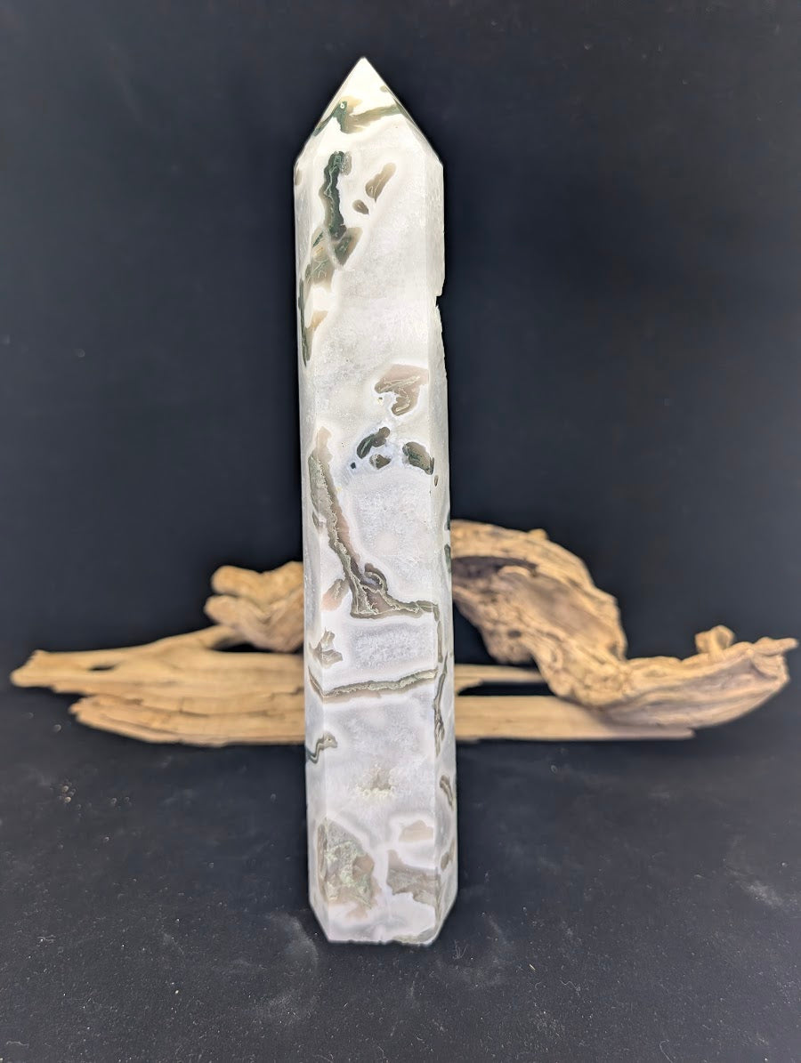 Face view of Moss Agate tower MA-01 highlighting natural druzy quartz vugs and forest-green plumes.