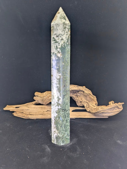 Full-height view of the 27cm Moss Agate tower MA-02 against a black collector's background.