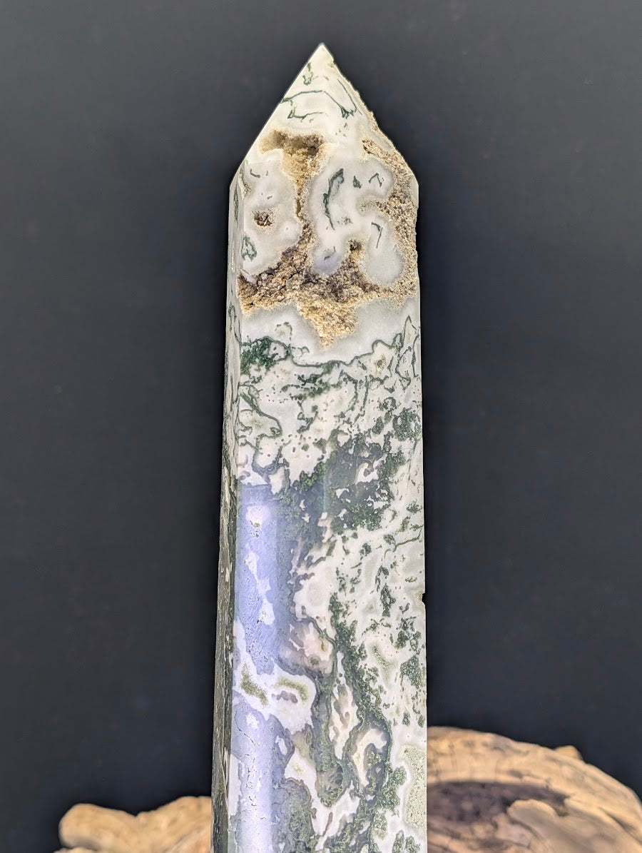 Close-up of the upper section of tower MA-02 showcasing a natural crystalline vug near the apex.