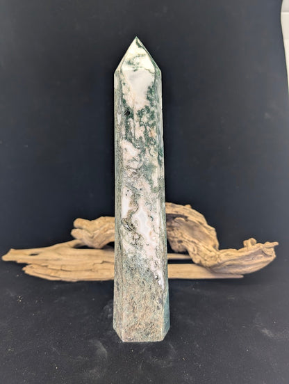 Reverse face of tower MA-03 showing consistent forest-green mineral growth throughout the stone.