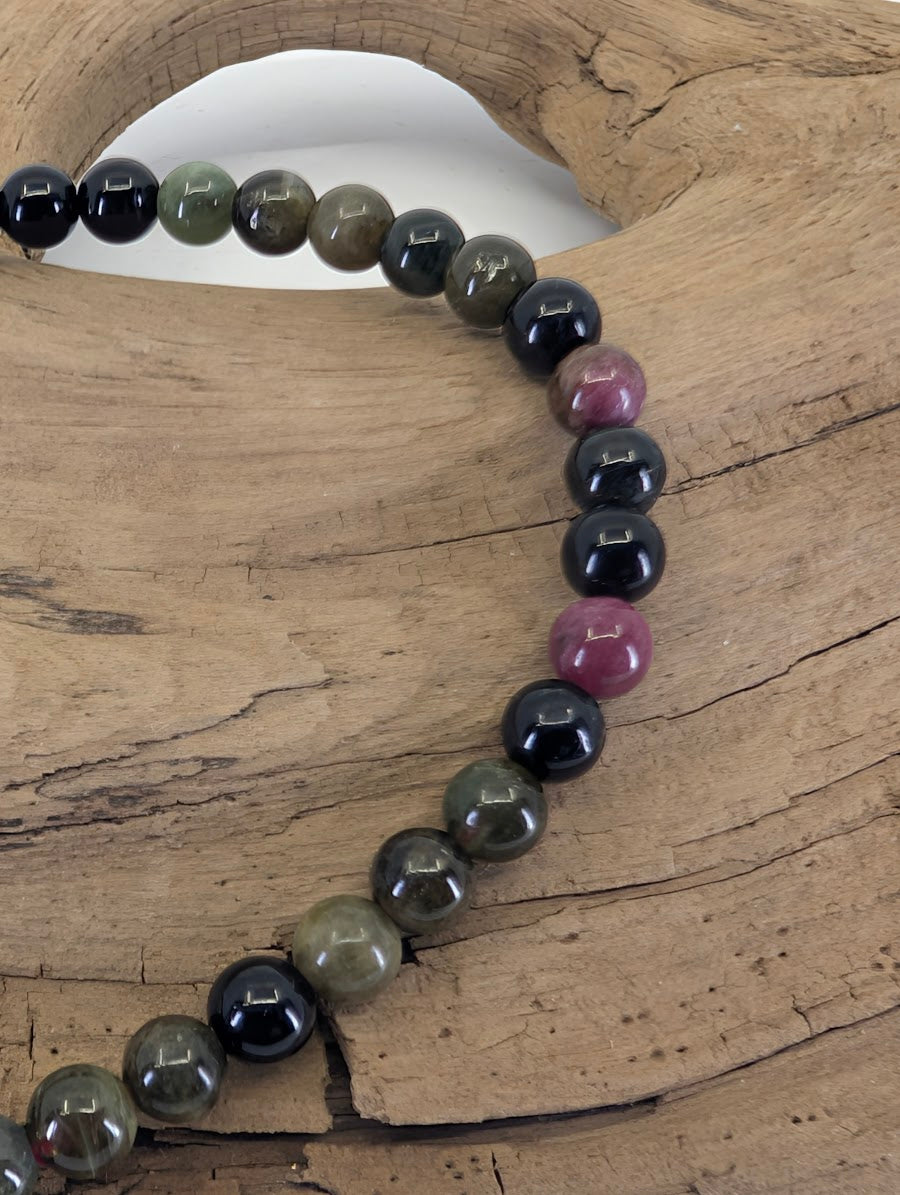Close-up of 4.5mm Brazilian Tourmaline beads highlighting natural color transitions and high clarity.