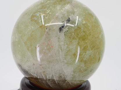 Close up of natural internal veils and structural lines in Zambian Citrine sphere.