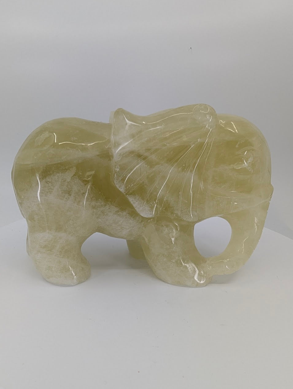Rear angled view of natural Lemon Citrine elephant carving