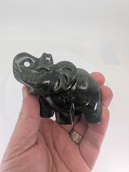 Nephrite Jade elephant carving shown in hand