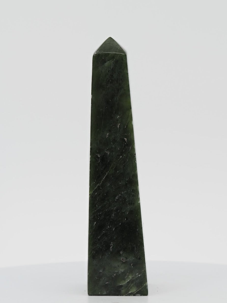 Polished Nephrite Jade tower from Pakistan featuring a deep dark spinach green color and silky waxy luster.