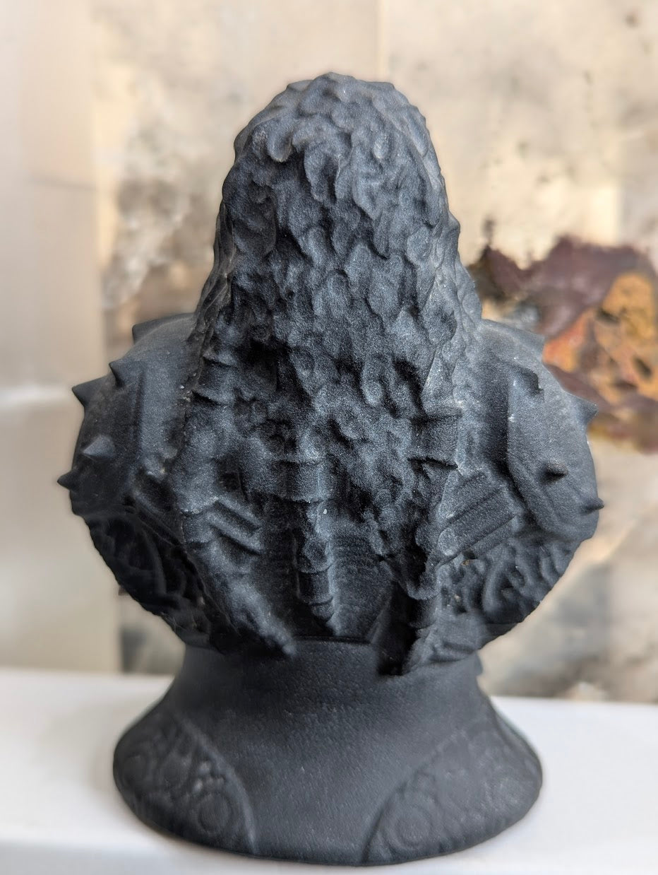 Back view of hand-carved volcanic glass Korsan bust.