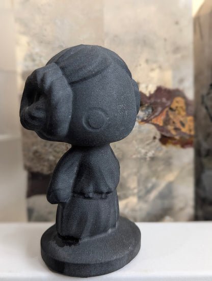 Angled view of matte black volcanic glass Princess Leia.