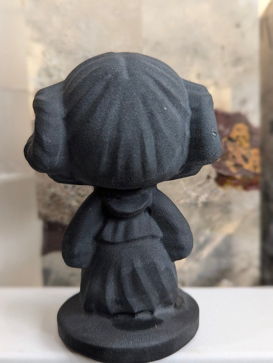 Rear view of hand-carved obsidian Princess Leia bust.