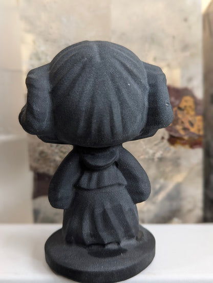 Rear view of hand-carved obsidian Princess Leia bust.