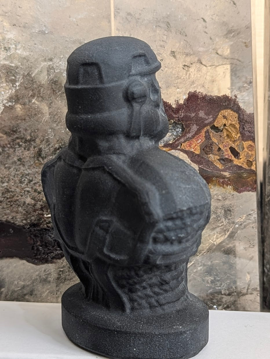 Three-quarter view of matte obsidian Stormtrooper showing helmet detail.