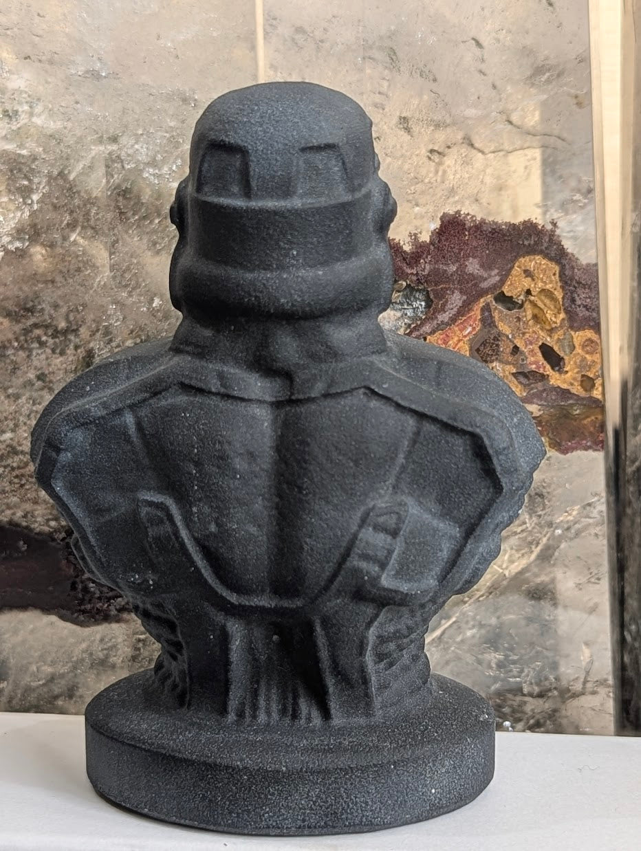 Rear view of matte black volcanic glass Stormtrooper carving.