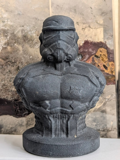 Front view of matte black obsidian Stormtrooper bust carving.