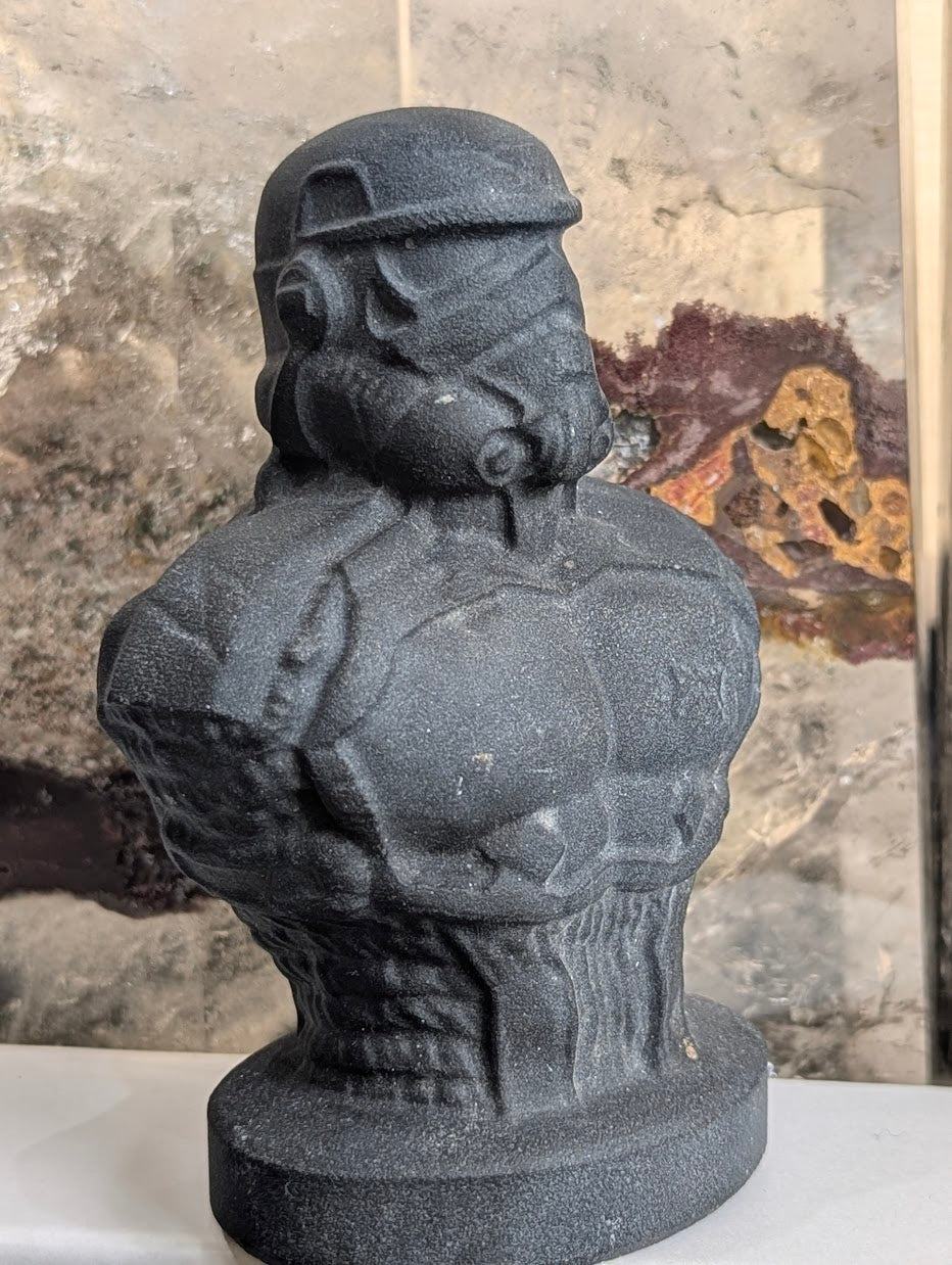 Side profile of hand-carved midnight obsidian Stormtrooper helmet.