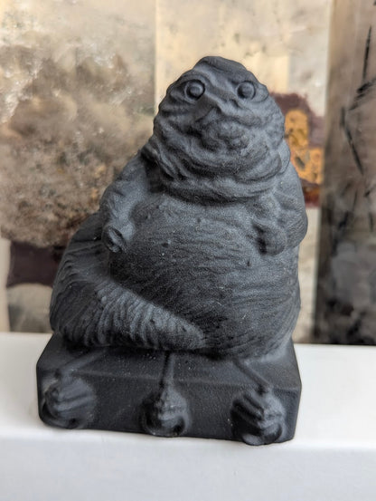 Front view of matte black obsidian Jabba the Hutt bust.