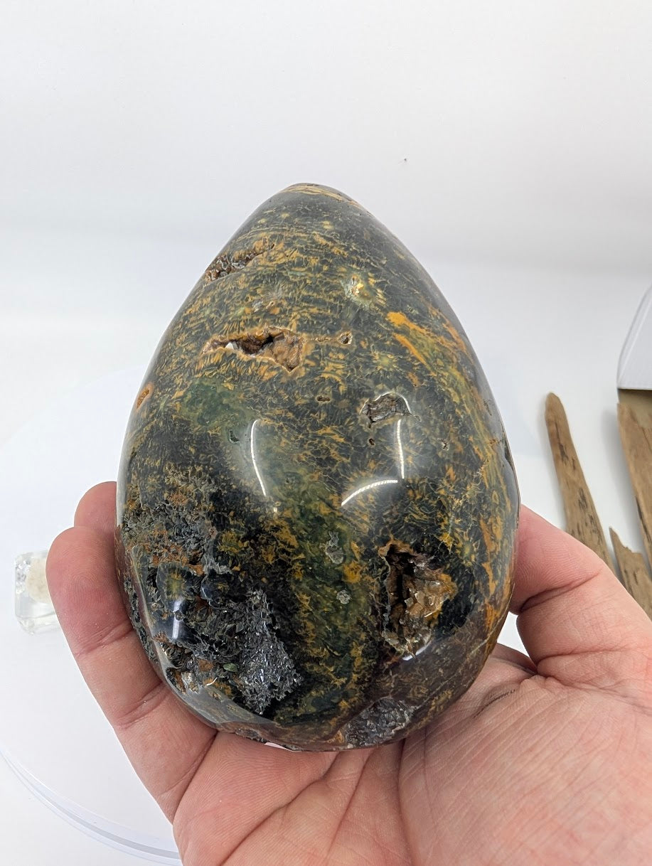 hand view of ocean jasper egg piece B with strong banding