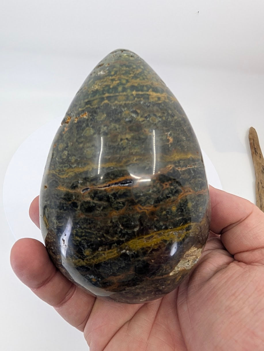Back view of ocean jasper egg piece E showing natural texture